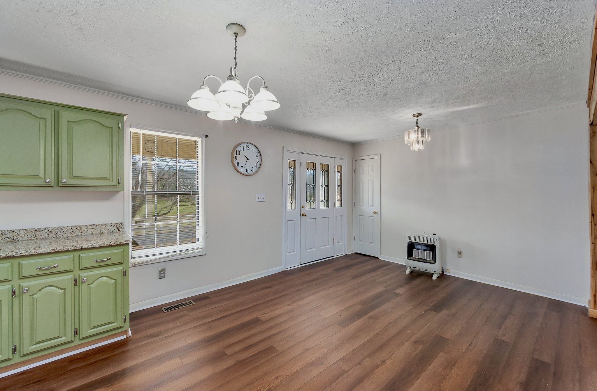 6675 Highway 100 Reagan, TN 38368 - Photo 4 of 32 a view of a room with wooden floors and ceiling fan