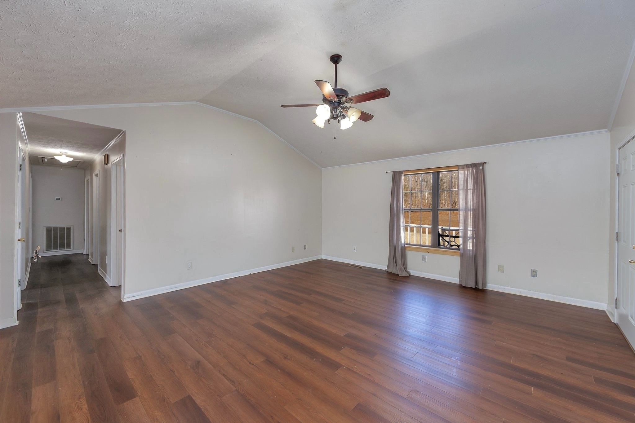 6675 Highway 100 Reagan, TN 38368 - Photo 10 of 32 a view of an empty room with window and wooden floor