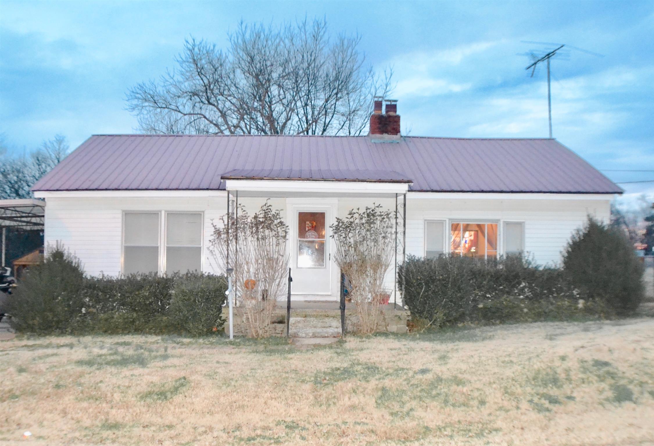 265 Old Temperance Hall Road Liberty, TN 37095 - Photo 1 of 15 a front view of a house with garden