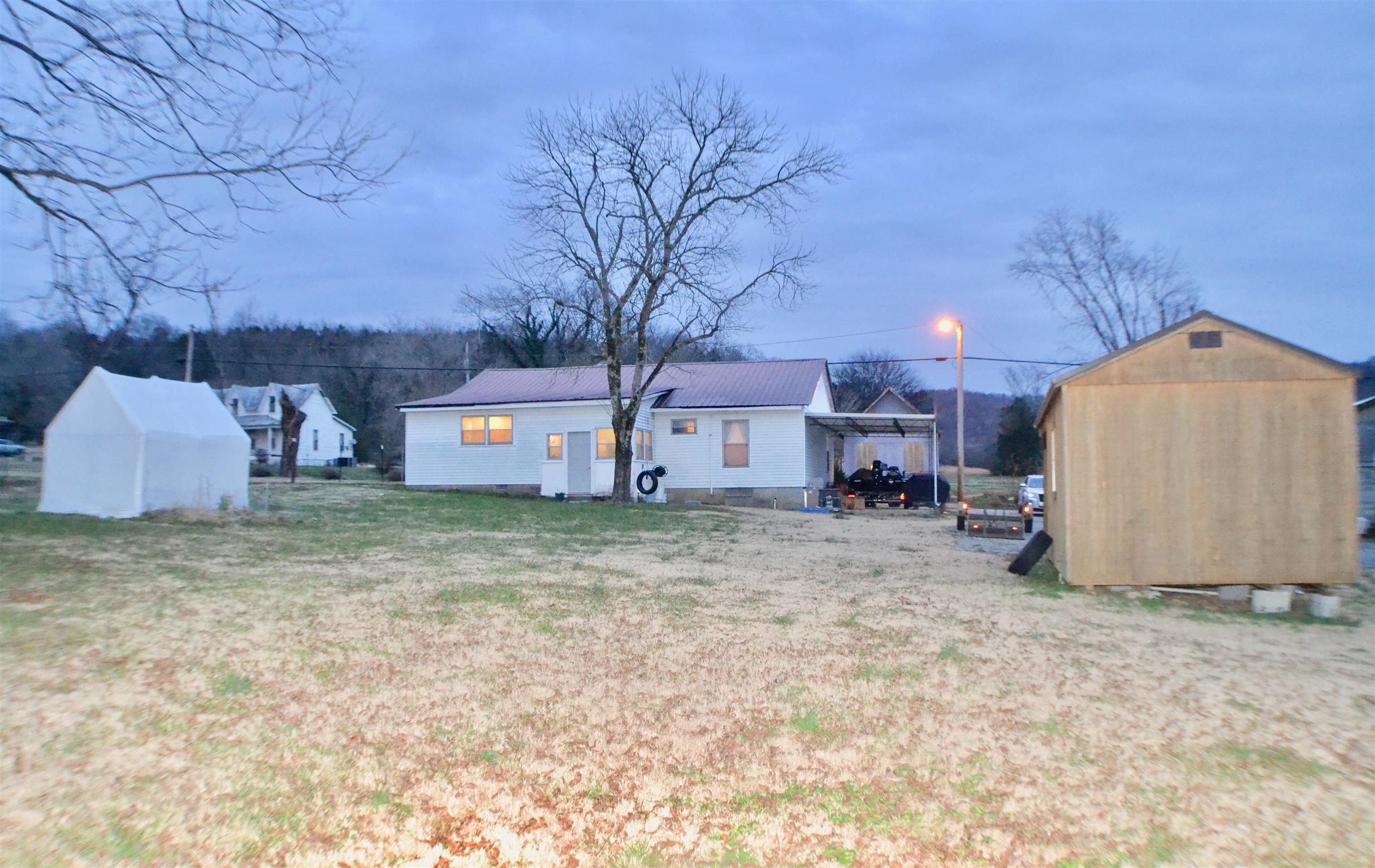 265 Old Temperance Hall Road Liberty, TN 37095 - Photo 14 of 15 a view of a house with a back yard