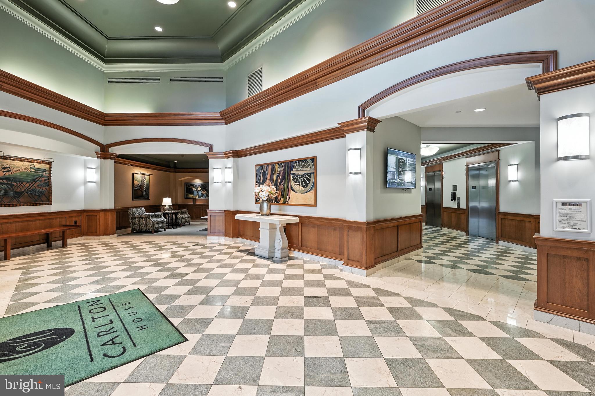 11800 Sunset Hills Road, Unit 818 Reston, VA 20190 - Photo 1 of 26 a living room with stainless steel appliances kitchen island granite countertop a rug and a view of living room