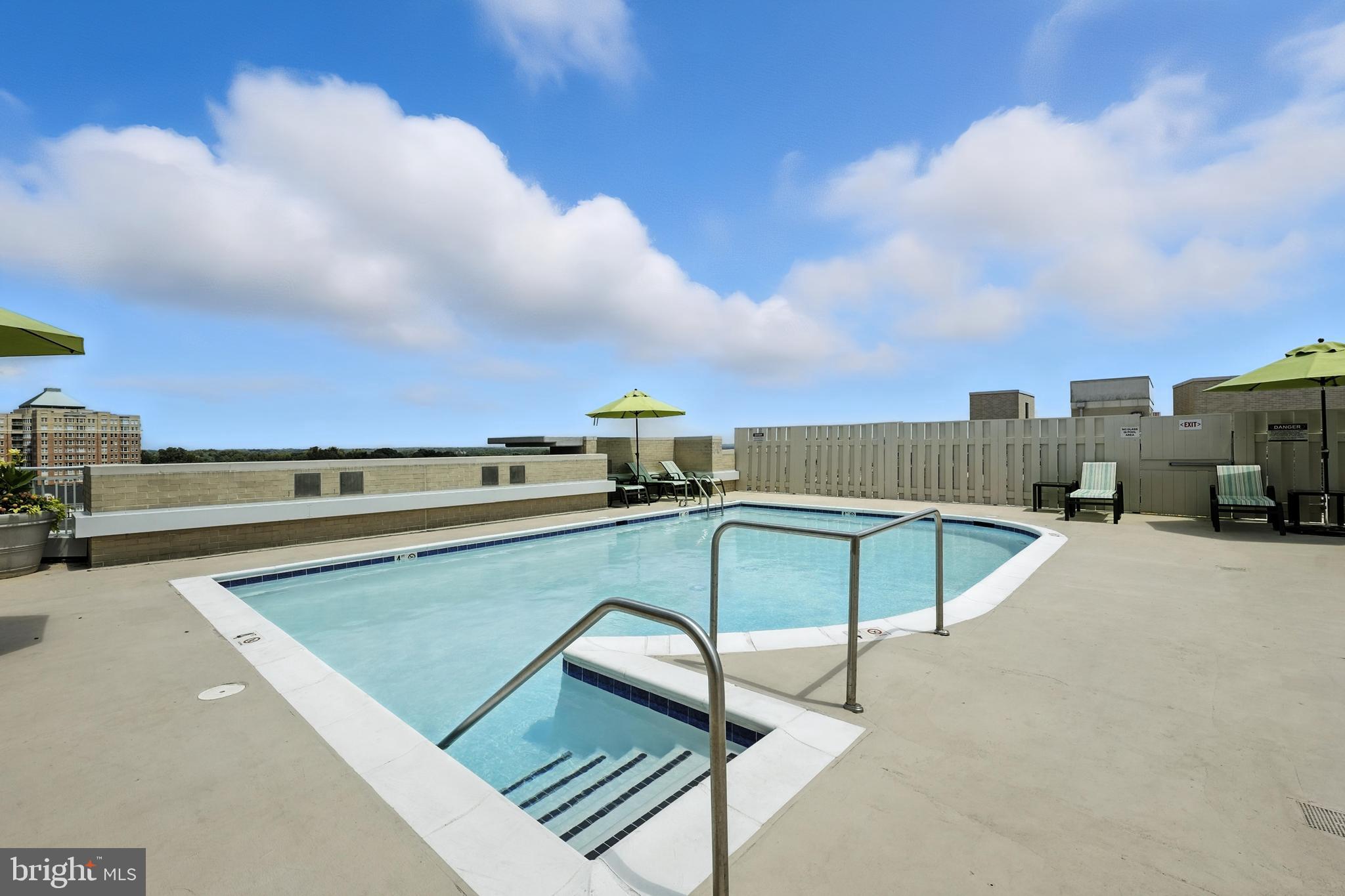 11800 Sunset Hills Road, Unit 818 Reston, VA 20190 - Photo 22 of 26 a terrace with a table and chairs