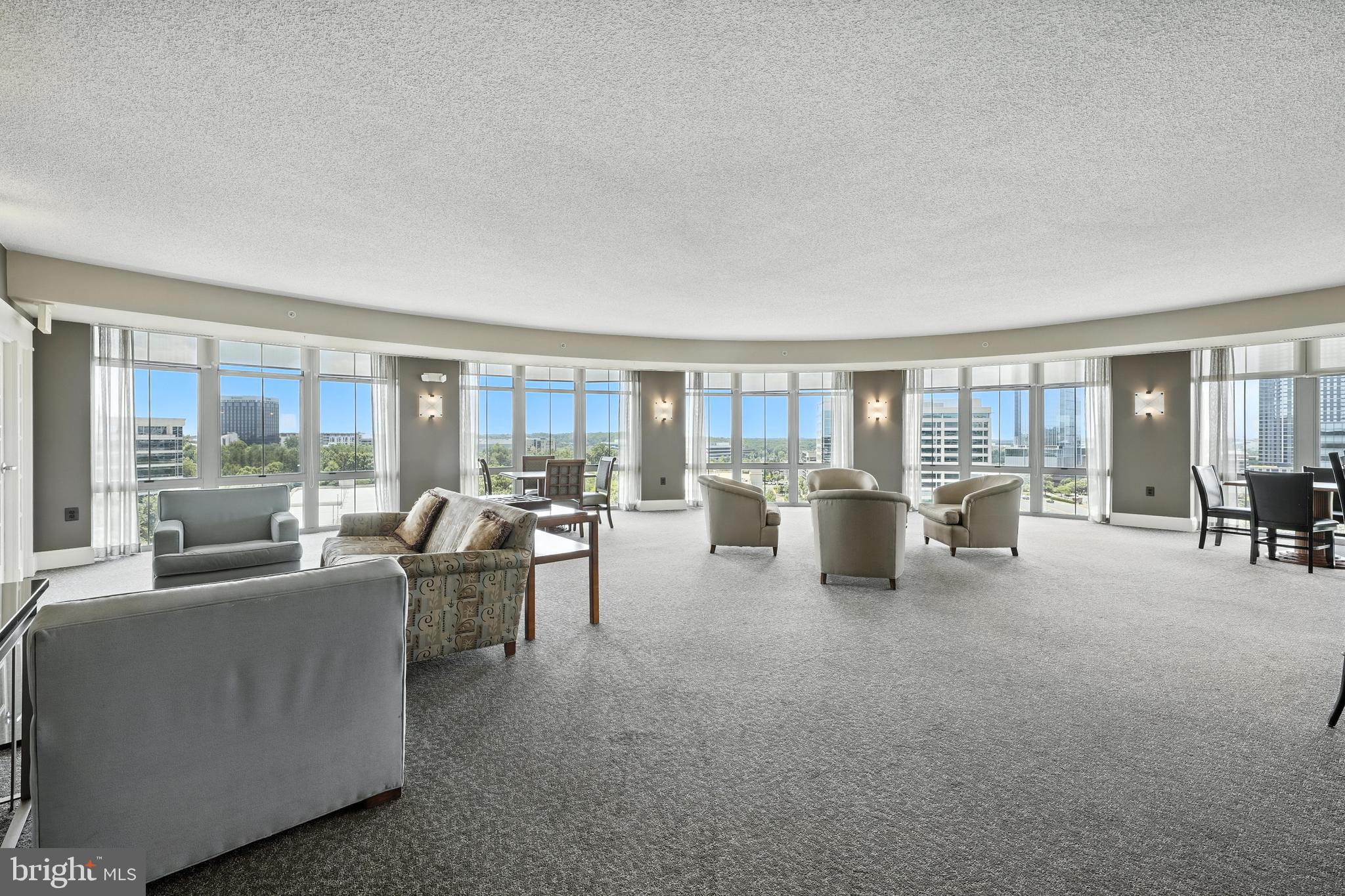 11800 Sunset Hills Road, Unit 818 Reston, VA 20190 - Photo 25 of 26 a living room with furniture and a table