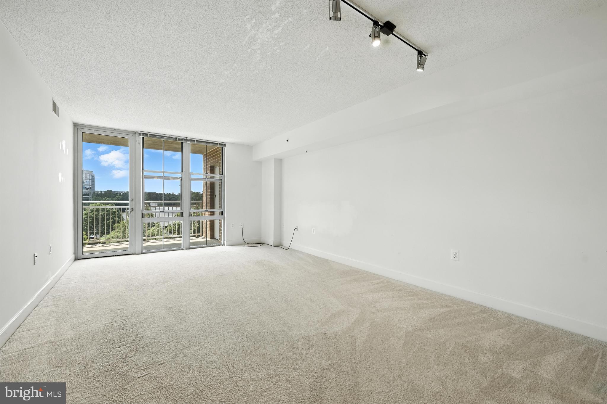 11800 Sunset Hills Road, Unit 818 Reston, VA 20190 - Photo 9 of 26 a view of an empty room with a window