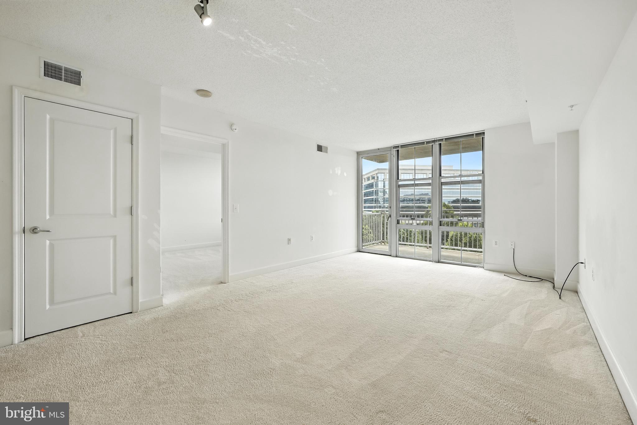 11800 Sunset Hills Road, Unit 818 Reston, VA 20190 - Photo 10 of 26 a view of an empty room with a window