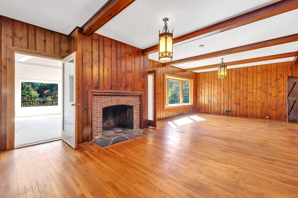 14 Pond Street Topsfield, MA 01983 - Photo 12 of 36 a view of a livingroom with a fireplace window and wooden floor