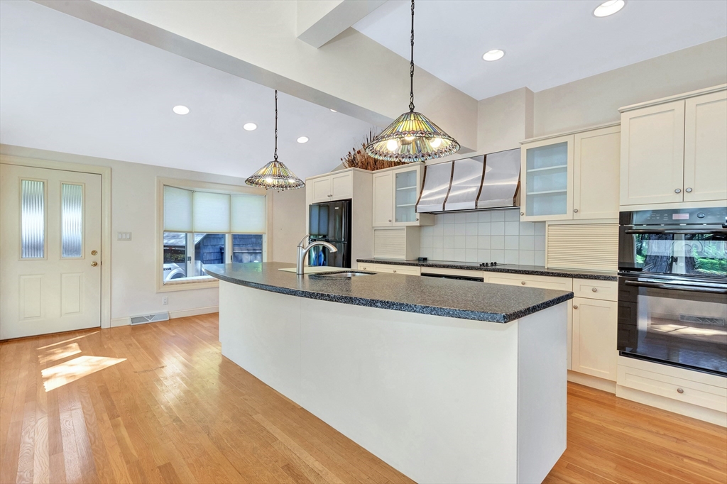 14 Pond Street Topsfield, MA 01983 - Photo 17 of 36 a large kitchen with stainless steel appliances kitchen island granite countertop a sink and cabinets