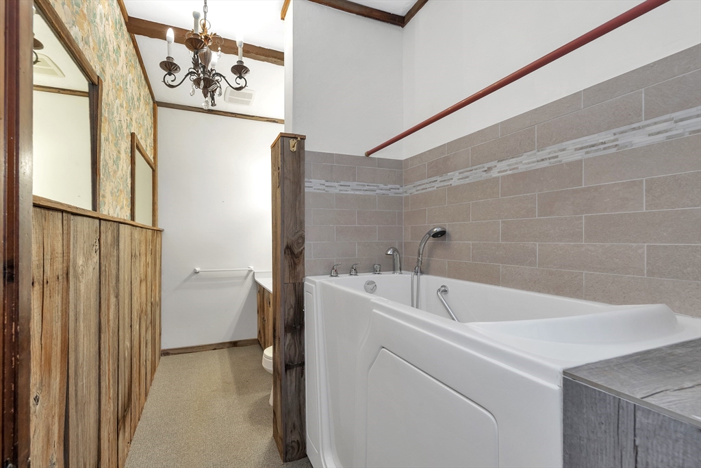 14 Pond Street Topsfield, MA 01983 - Photo 20 of 36 a bathroom with a bathtub and shower