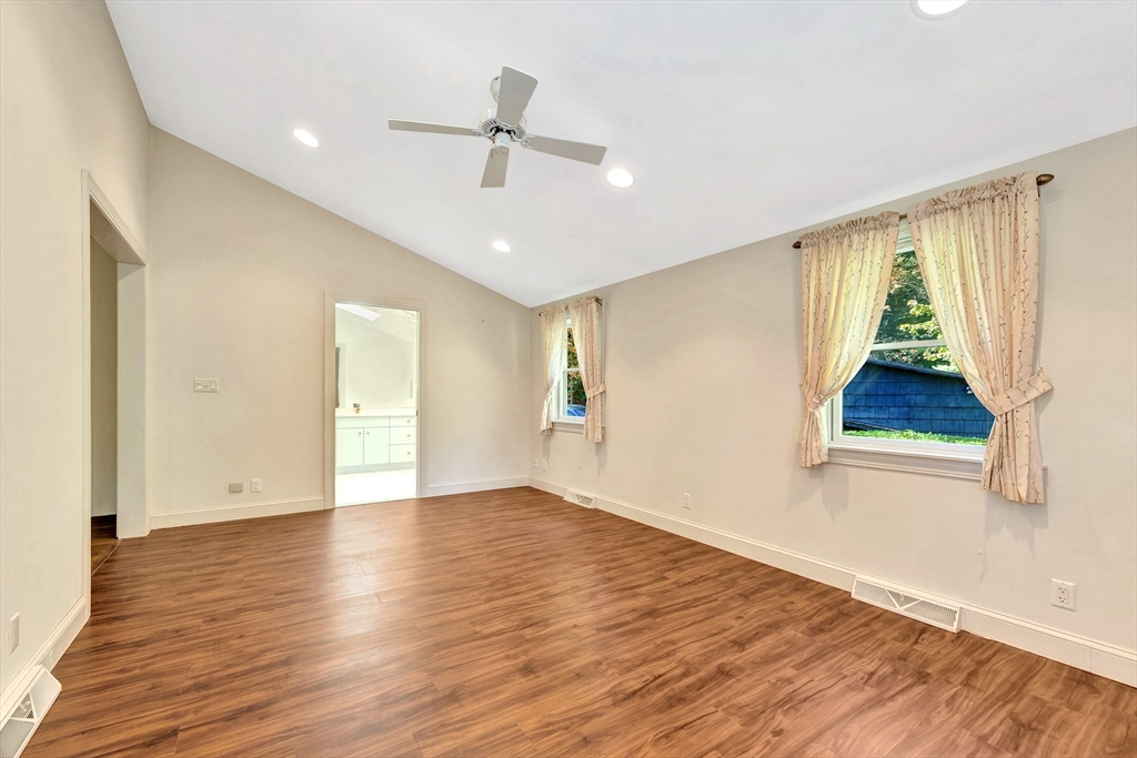 14 Pond Street Topsfield, MA 01983 - Photo 24 of 36 a view of an empty room with wooden floor and a window