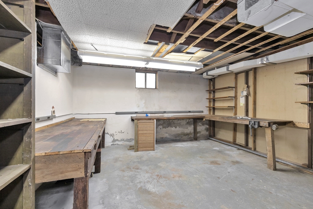 14 Pond Street Topsfield, MA 01983 - Photo 34 of 36 a bedroom with furniture and a window