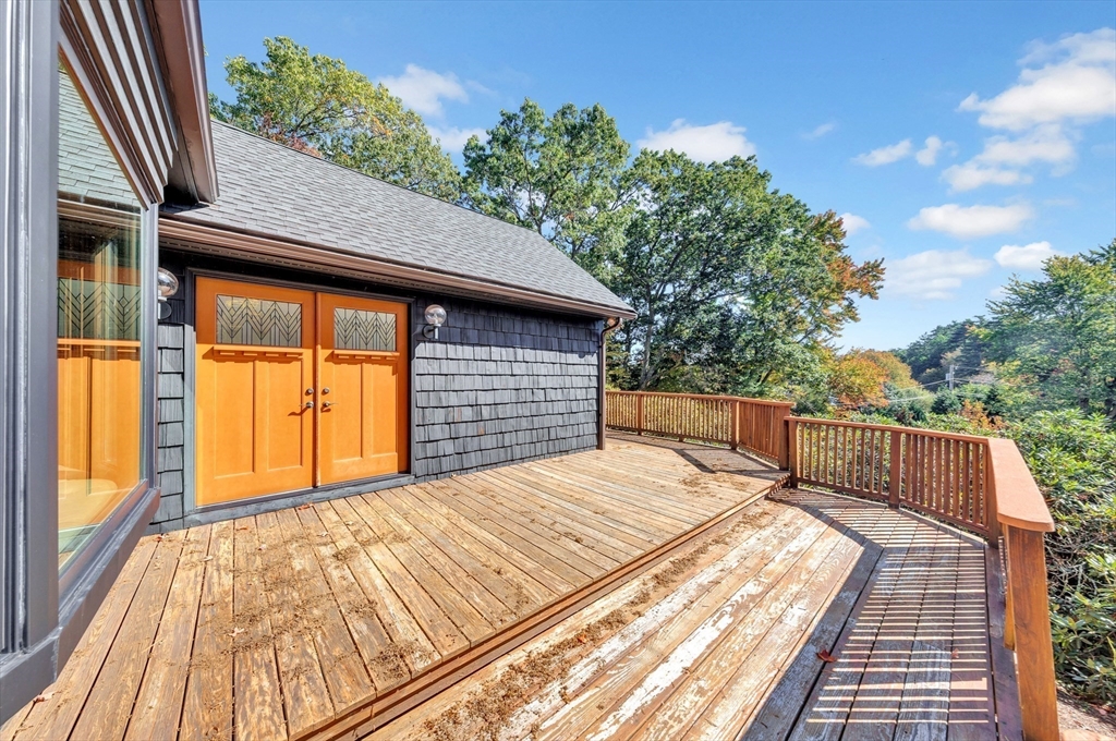 14 Pond Street Topsfield, MA 01983 - Photo 4 of 36 a view of balcony with wooden floor and fence