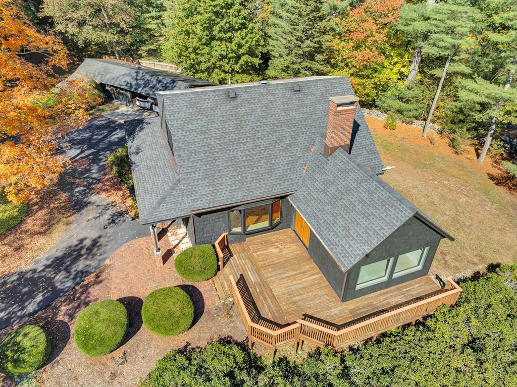14 Pond Street Topsfield, MA 01983 - Photo 8 of 36 an aerial view of a house with swimming pool and large trees