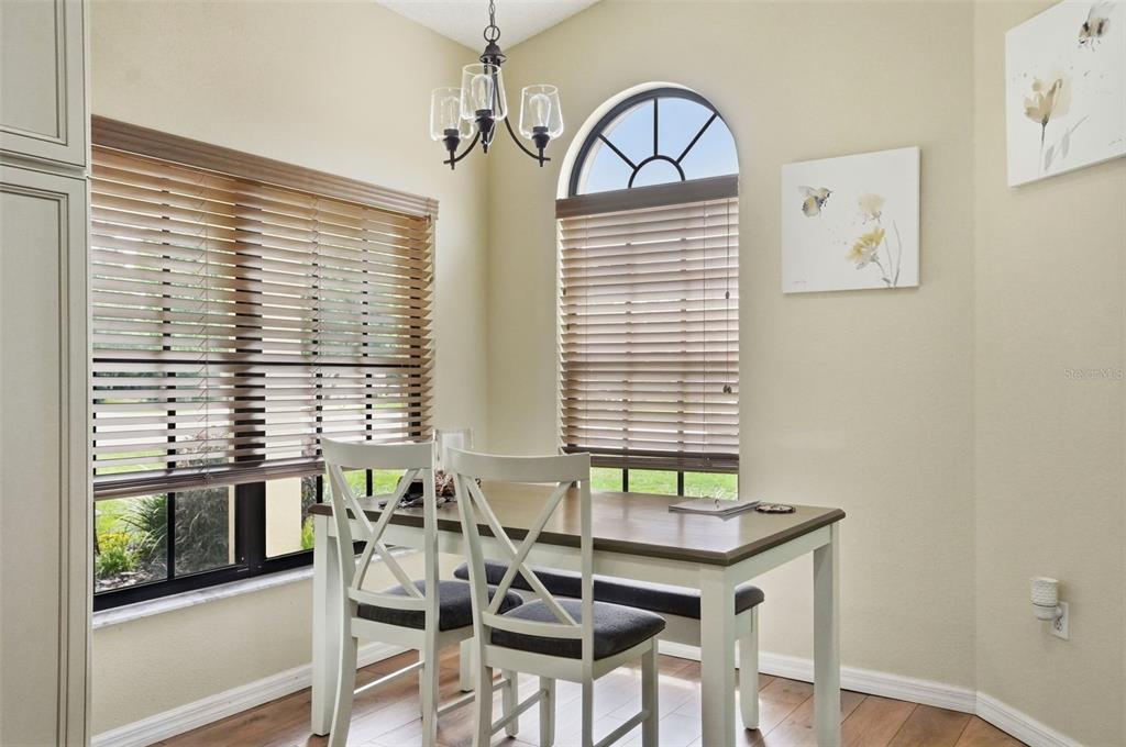 11437 Deercroft Court Spring Hill, FL 34609 - Photo 19 of 37 a view of a dining room with furniture window and wooden floor