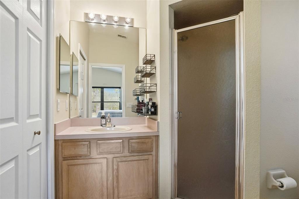 11437 Deercroft Court Spring Hill, FL 34609 - Photo 23 of 37 a bathroom with a sink and a mirror