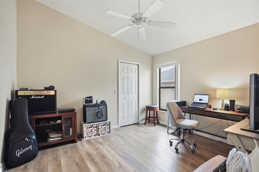 11437 Deercroft Court Spring Hill, FL 34609 - Photo 24 of 37 a view of a workspace with furniture and a window