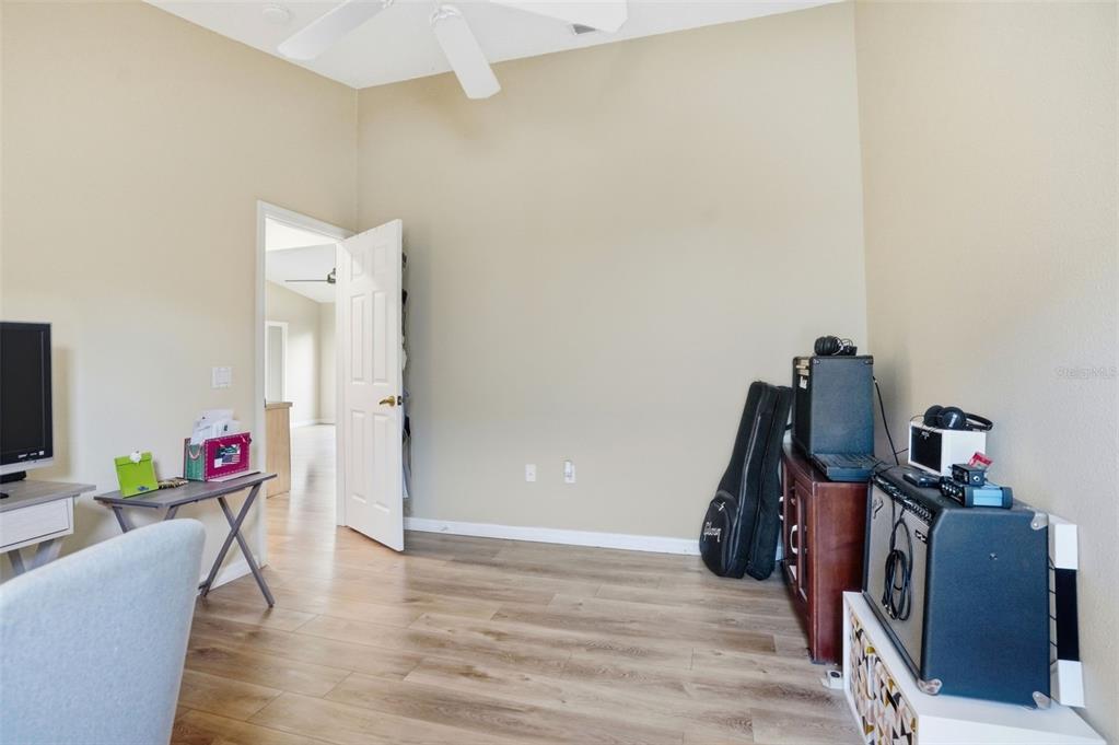 11437 Deercroft Court Spring Hill, FL 34609 - Photo 25 of 37 a view of a workspace with furniture and wooden floor
