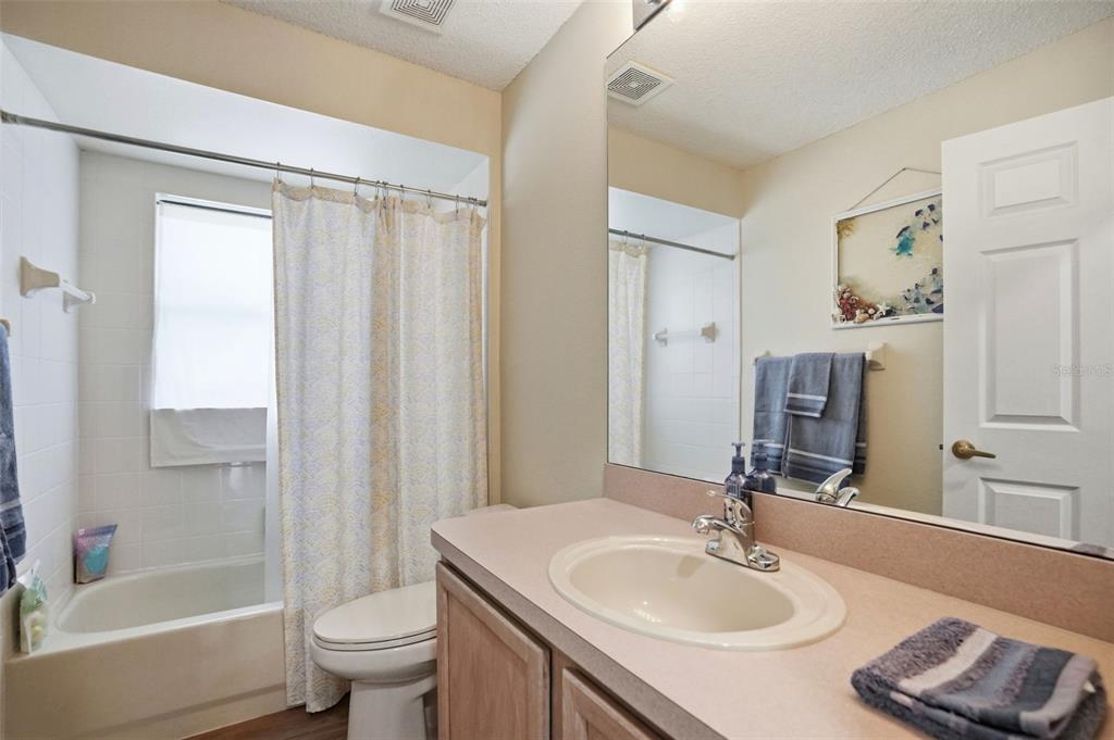 11437 Deercroft Court Spring Hill, FL 34609 - Photo 26 of 37 a bathroom with a sink toilet and shower