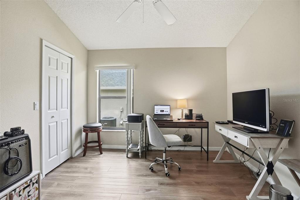 11437 Deercroft Court Spring Hill, FL 34609 - Photo 27 of 37 a view of a workspace with furniture and a window