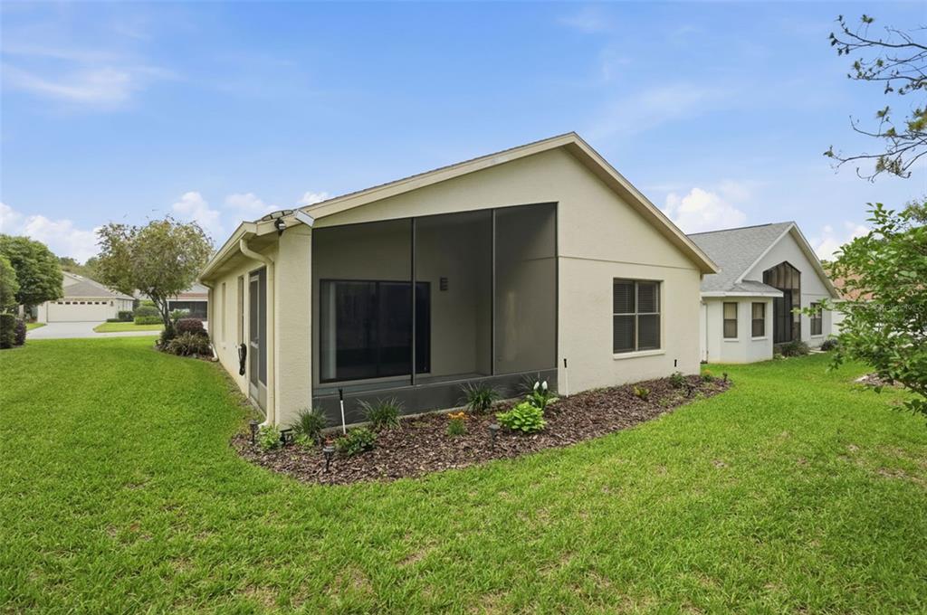 11437 Deercroft Court Spring Hill, FL 34609 - Photo 34 of 37 a view of a house with a yard