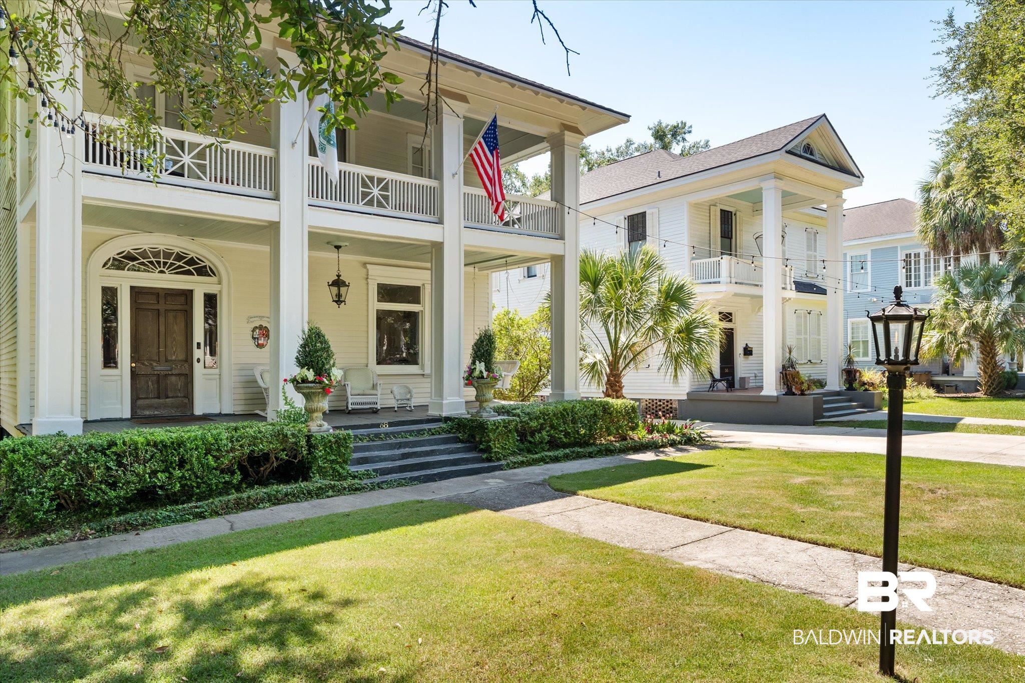 68 North Monterey Street Mobile, AL 36604 - Photo 29 of 30 View of front of property with a front lawn, covered porch, and a balcony