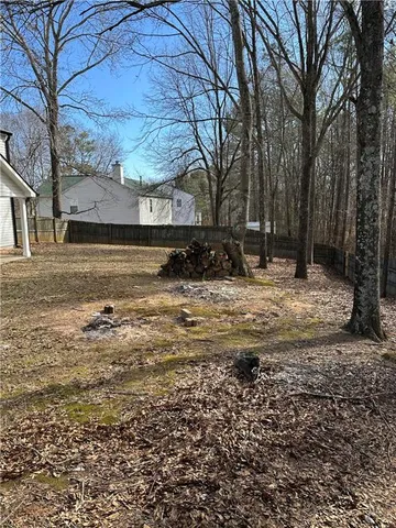 a view of a house with snow on the yard