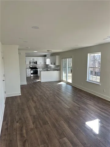 a view of a kitchen with a sink and dishwasher cabinets