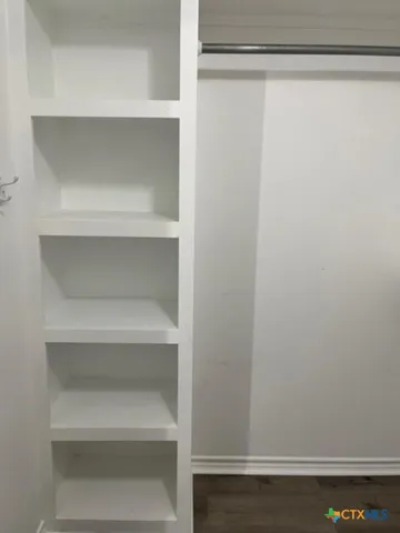 a view of an empty walk in closet