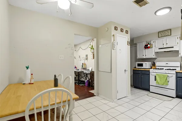 a kitchen with stainless steel appliances a refrigerator and a stove top oven