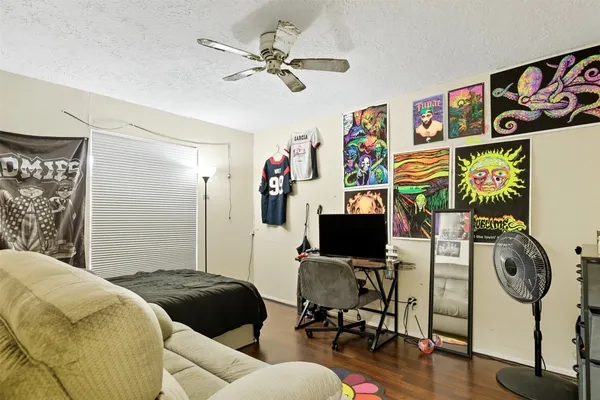 a bedroom with a bed and a chair
