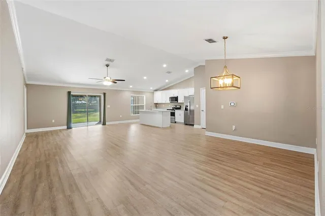 a view of a kitchen with a dishwasher cabinets and wooden floor