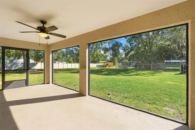 a view of a room with a big yard