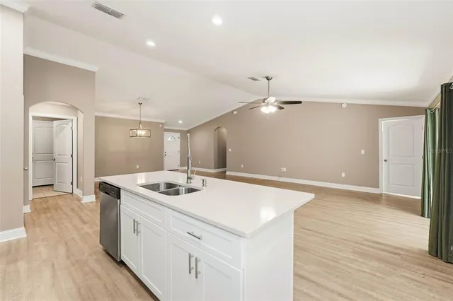 a bathroom with a sink a vanity and a mirror