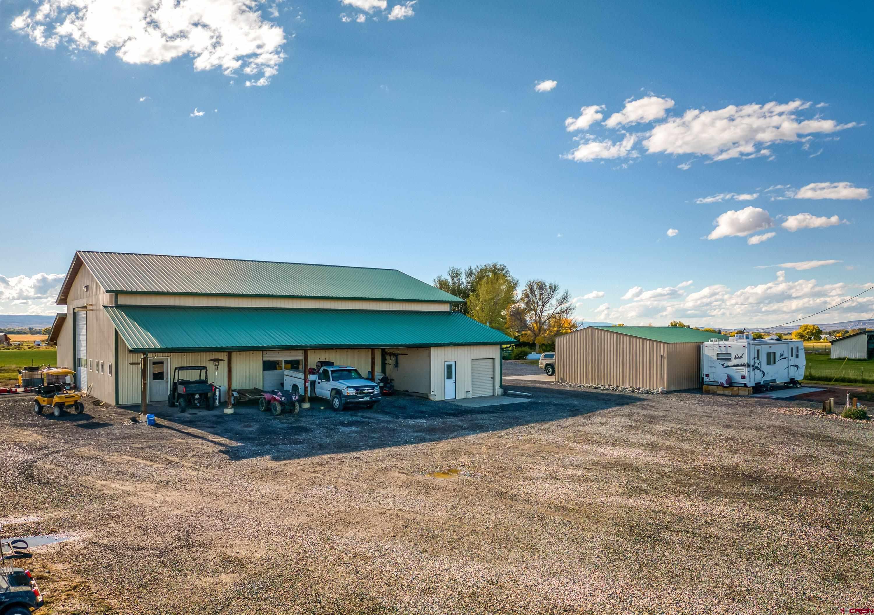 17938 B Road Delta, CO 81416 - Photo 17 of 41 a view of a house with a yard and sitting area