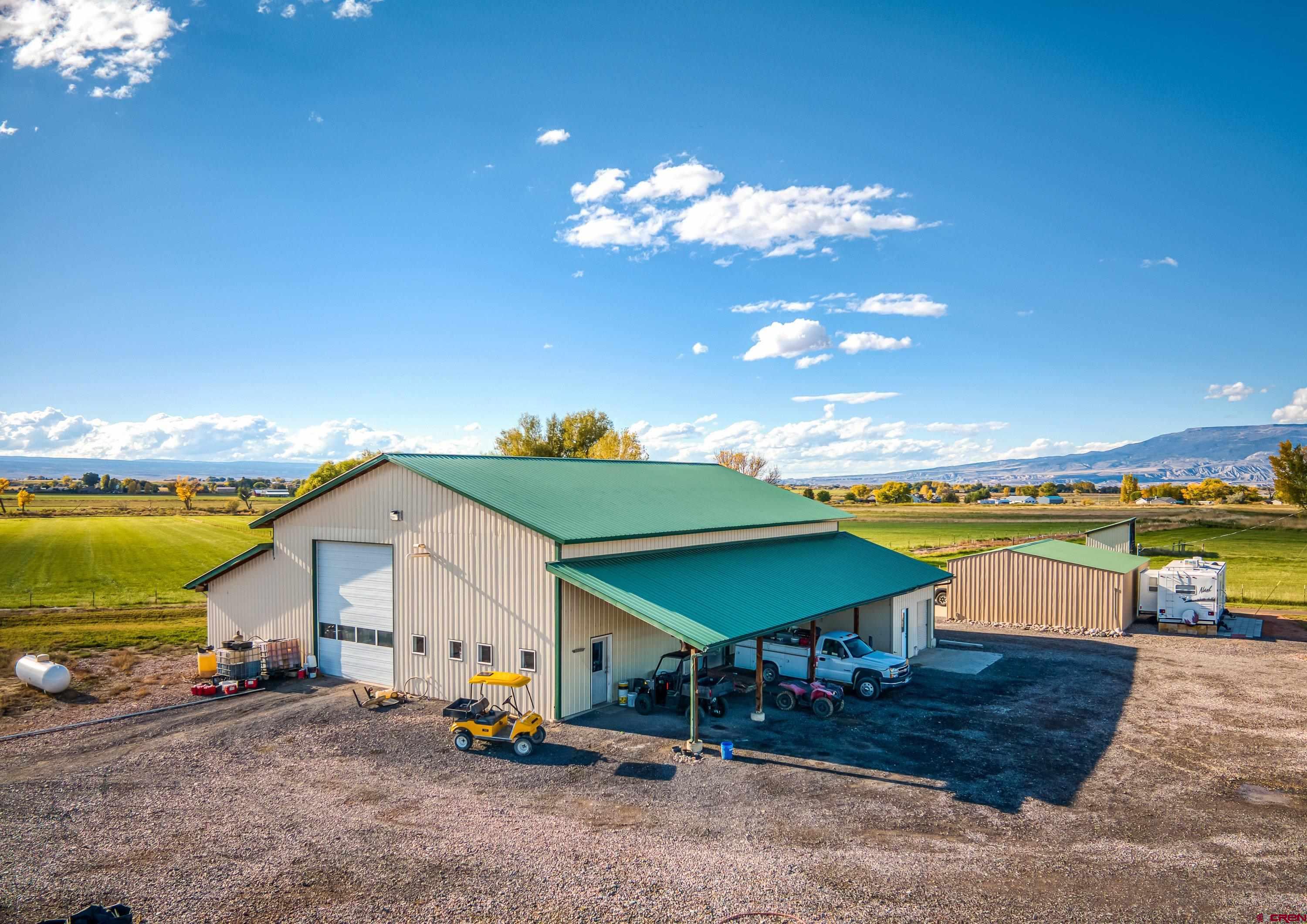 17938 B Road Delta, CO 81416 - Photo 18 of 41 a view of a house with swimming pool and sitting area