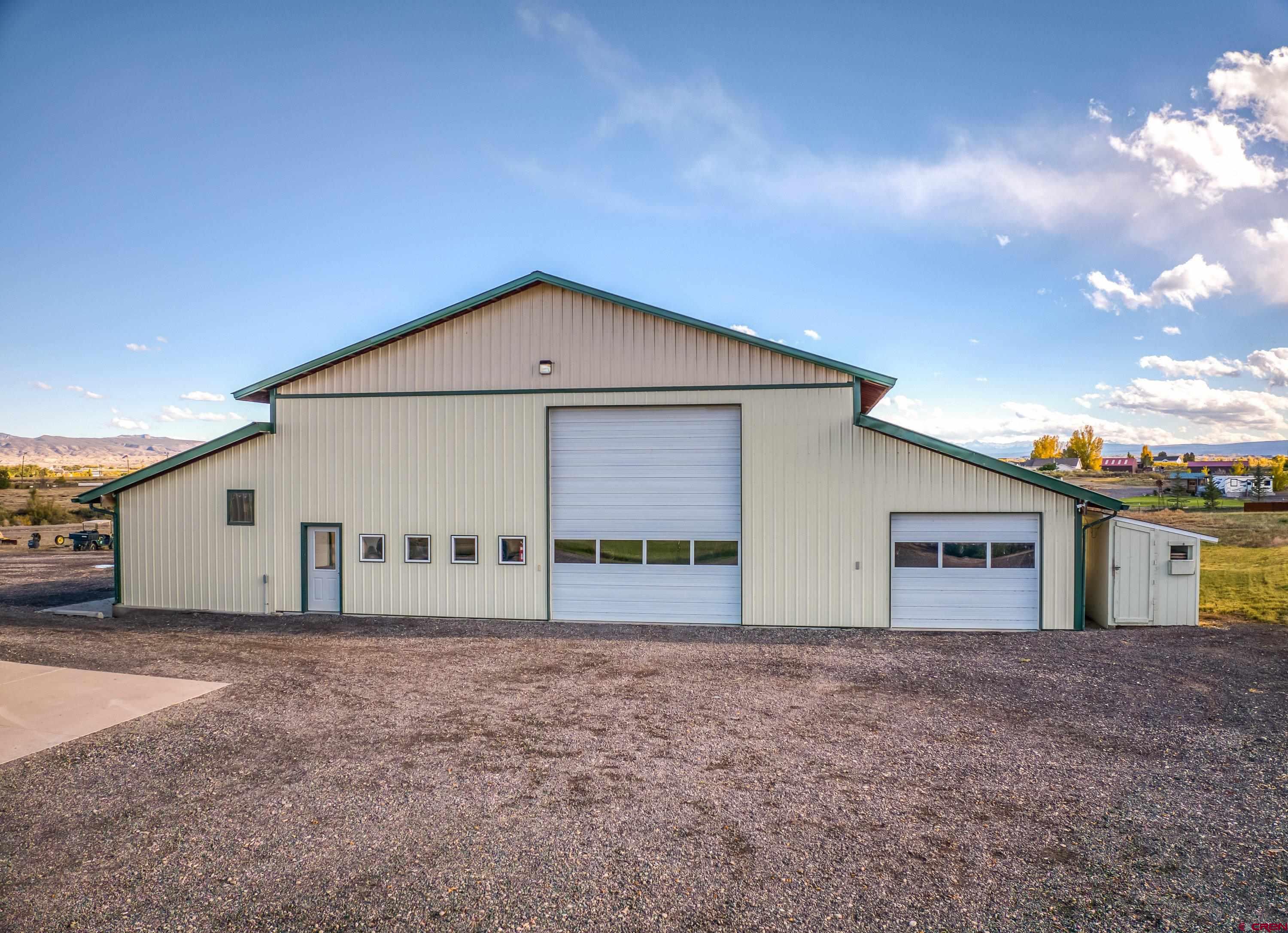 17938 B Road Delta, CO 81416 - Photo 20 of 41 a front view of a house with large windows