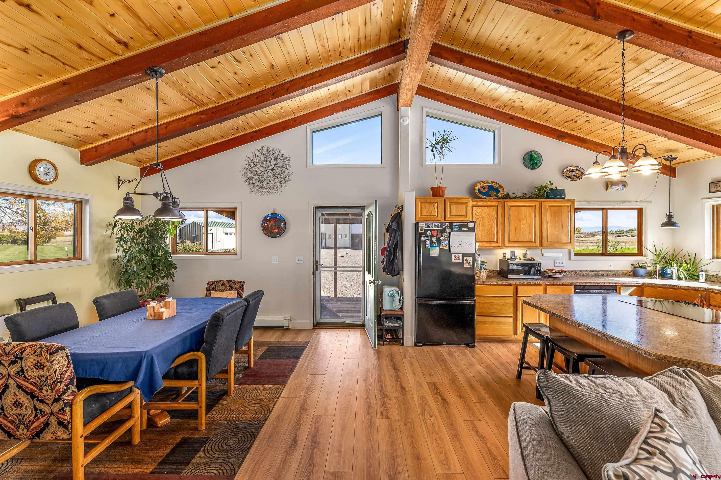 17938 B Road Delta, CO 81416 - Photo 2 of 41 a view of a dining room with furniture and wooden floor