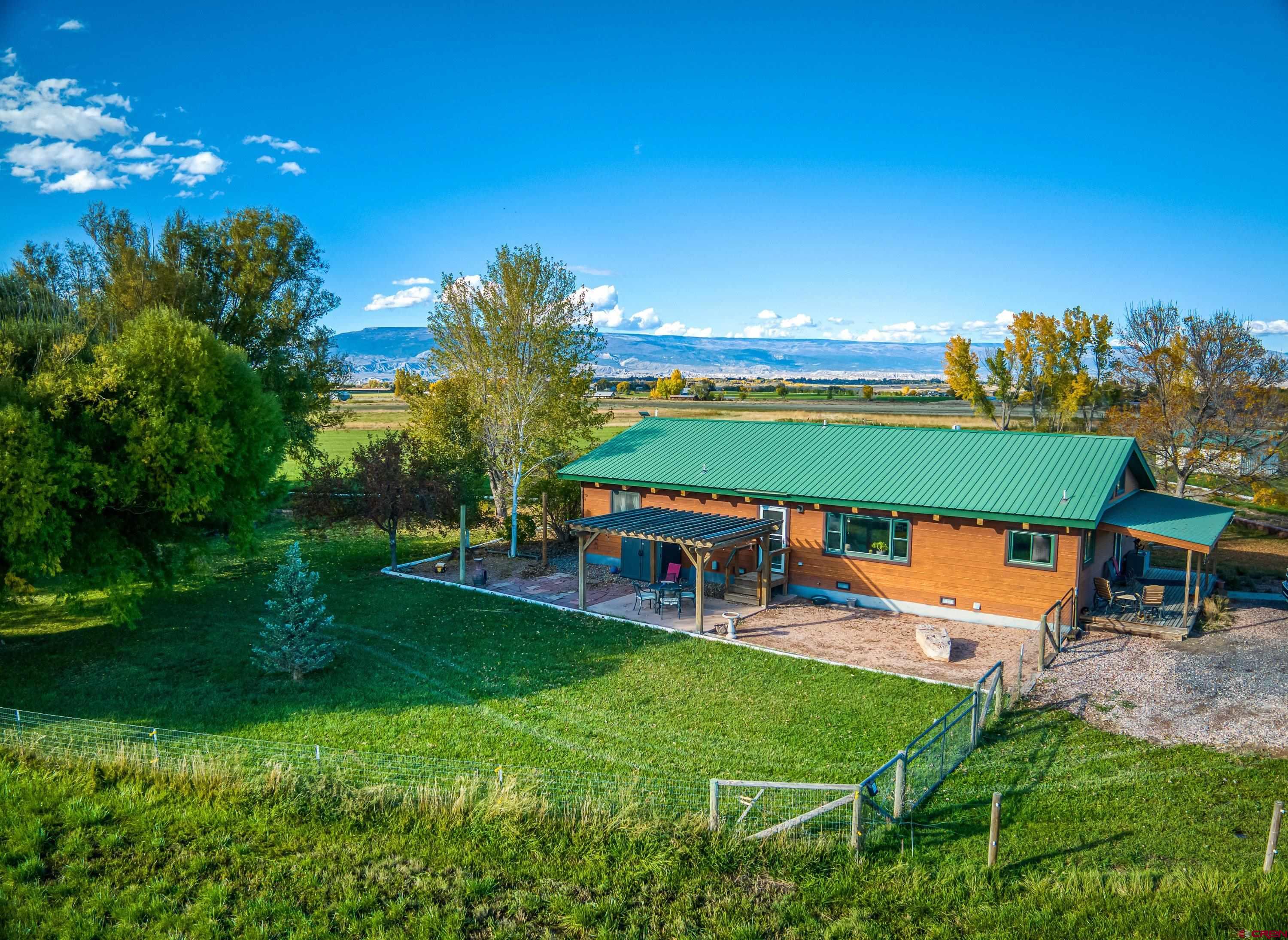 17938 B Road Delta, CO 81416 - Photo 22 of 41 an outdoor view of a house with a garden