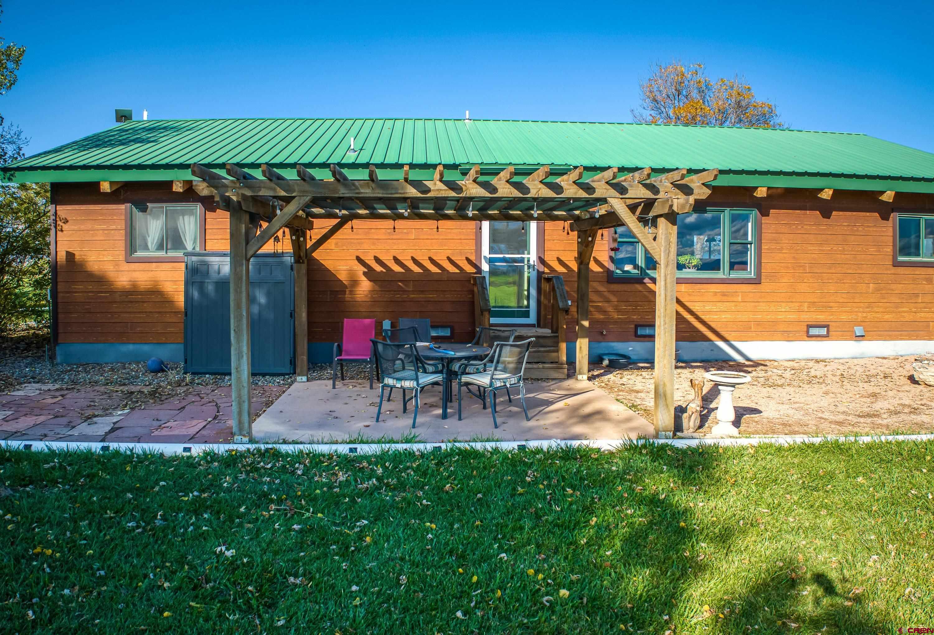 17938 B Road Delta, CO 81416 - Photo 24 of 41 an outdoor view of a house with a yard