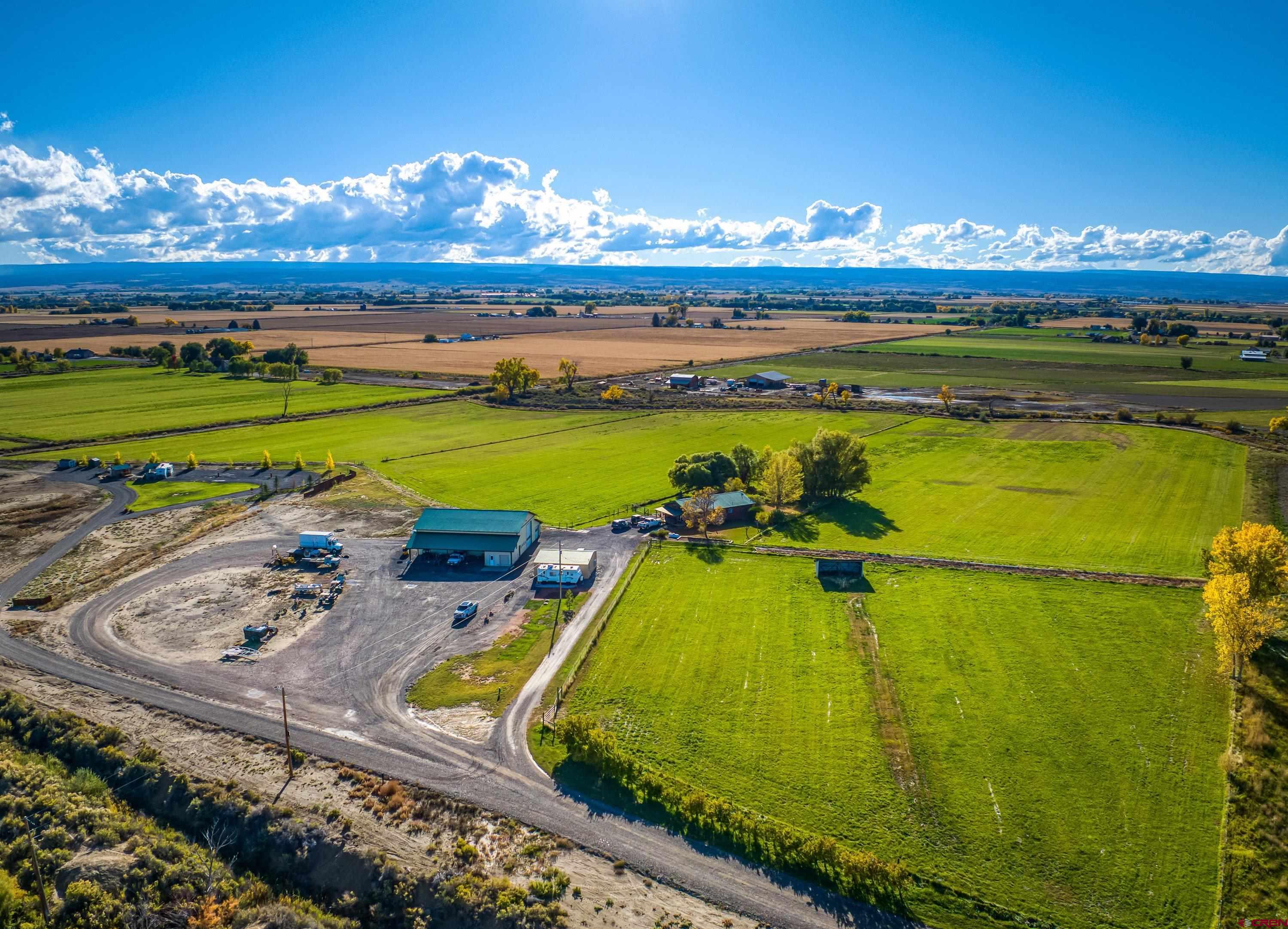 17938 B Road Delta, CO 81416 - Photo 26 of 41 a view of a swimming pool with a table and chairs