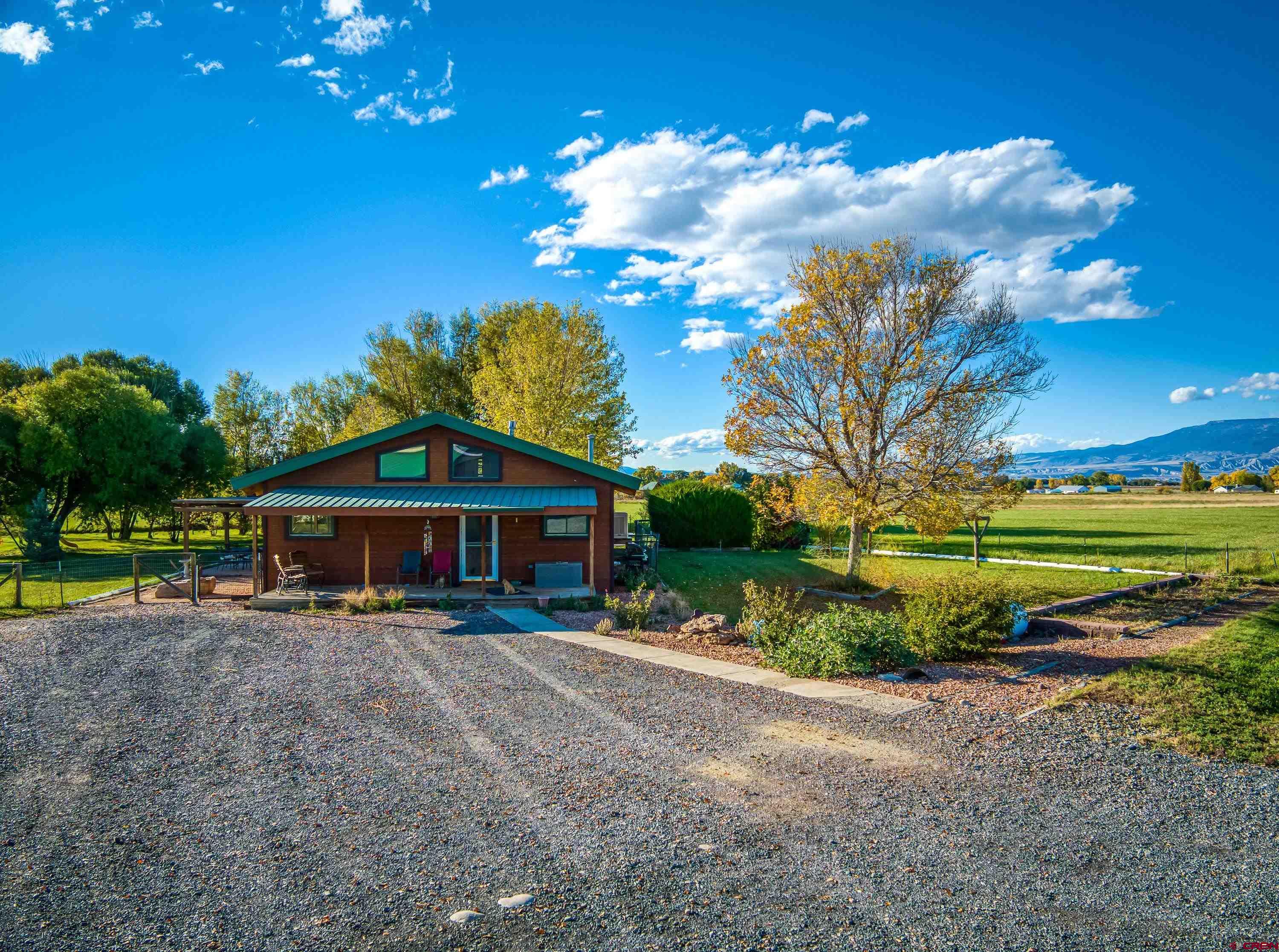17938 B Road Delta, CO 81416 - Photo 28 of 41 a view of a house with a yard