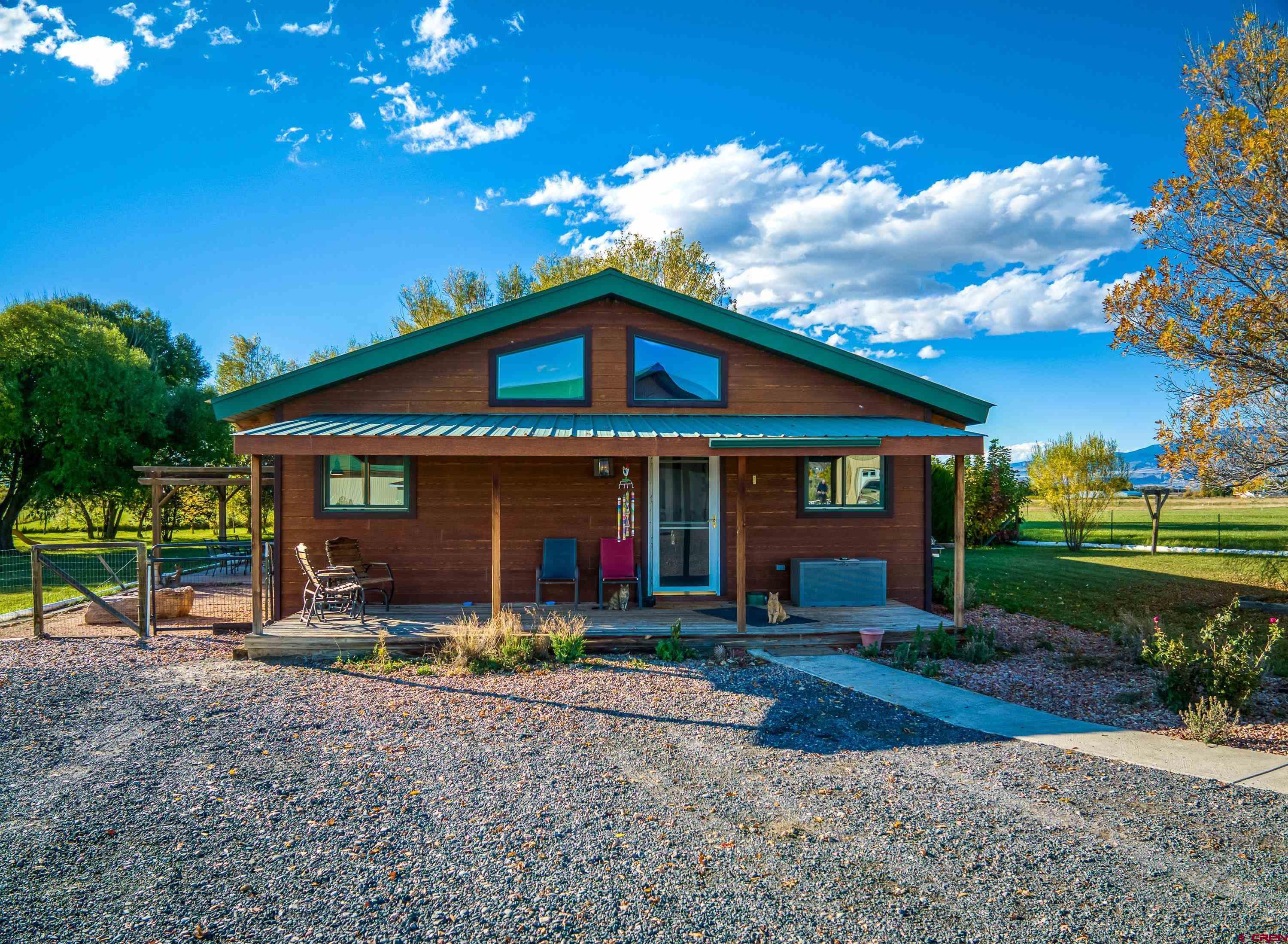17938 B Road Delta, CO 81416 - Photo 29 of 41 a front view of a house with garden