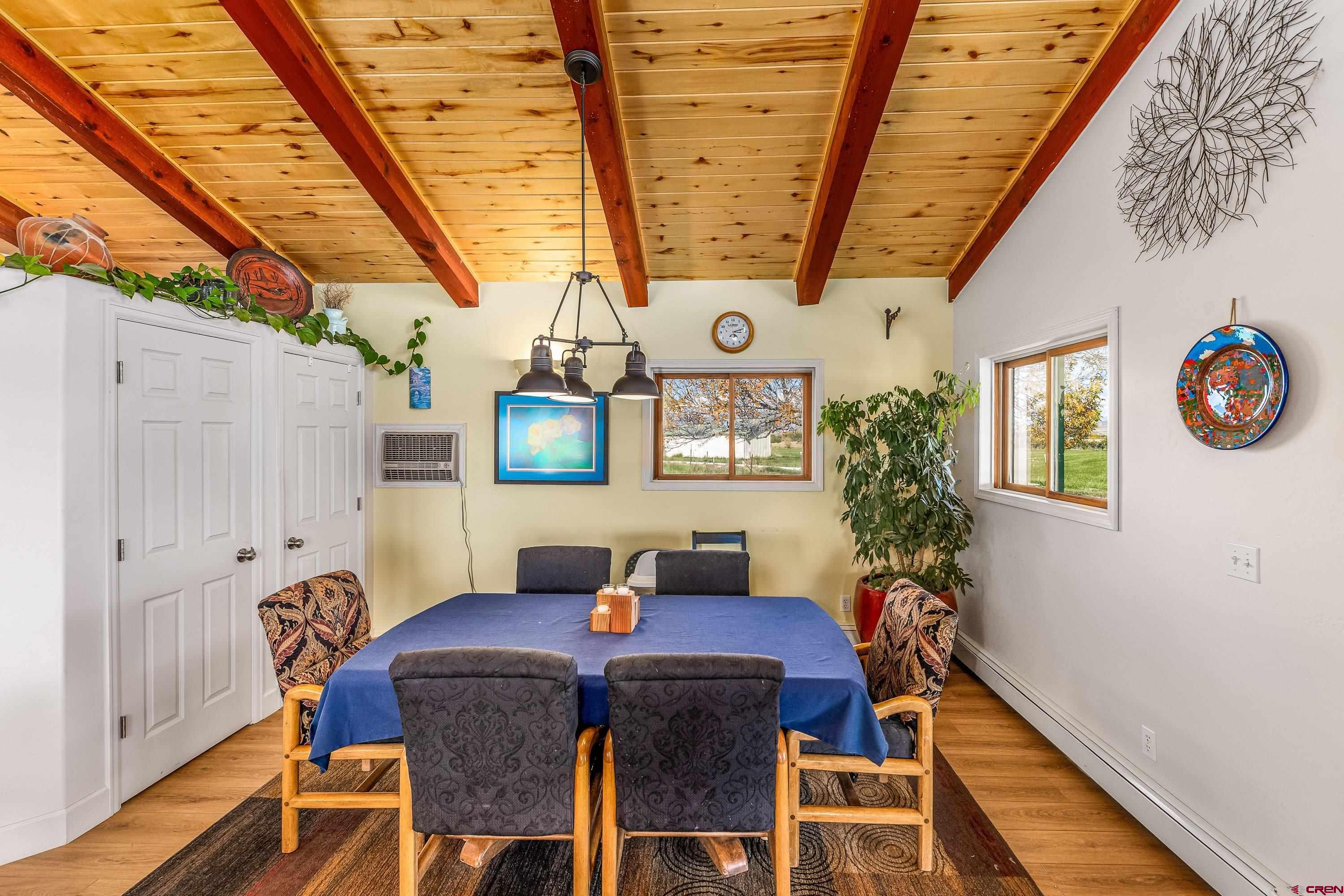 17938 B Road Delta, CO 81416 - Photo 3 of 41 a view of a dining room with furniture and a window
