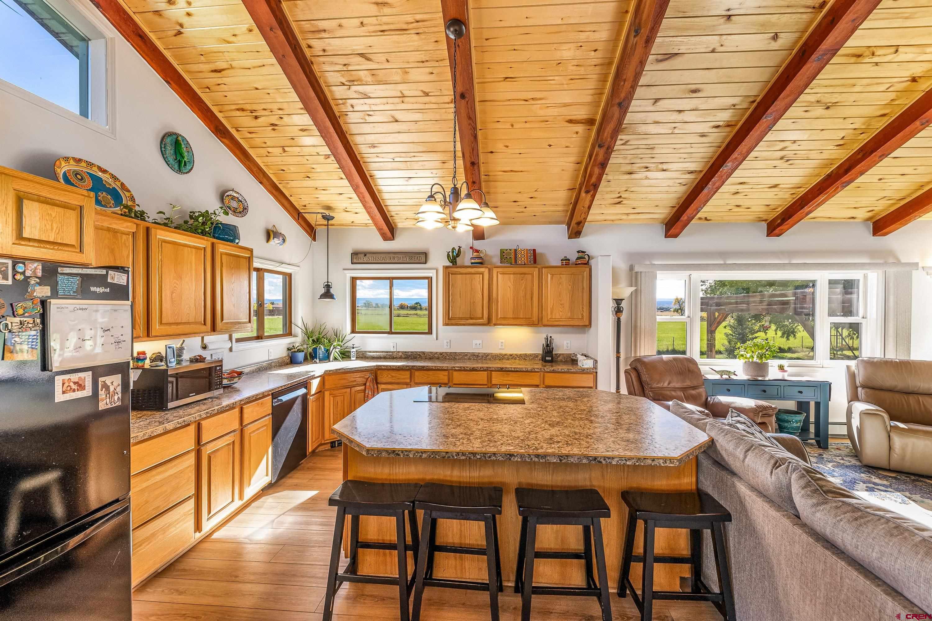 17938 B Road Delta, CO 81416 - Photo 4 of 41 a kitchen with sink a stove and chairs