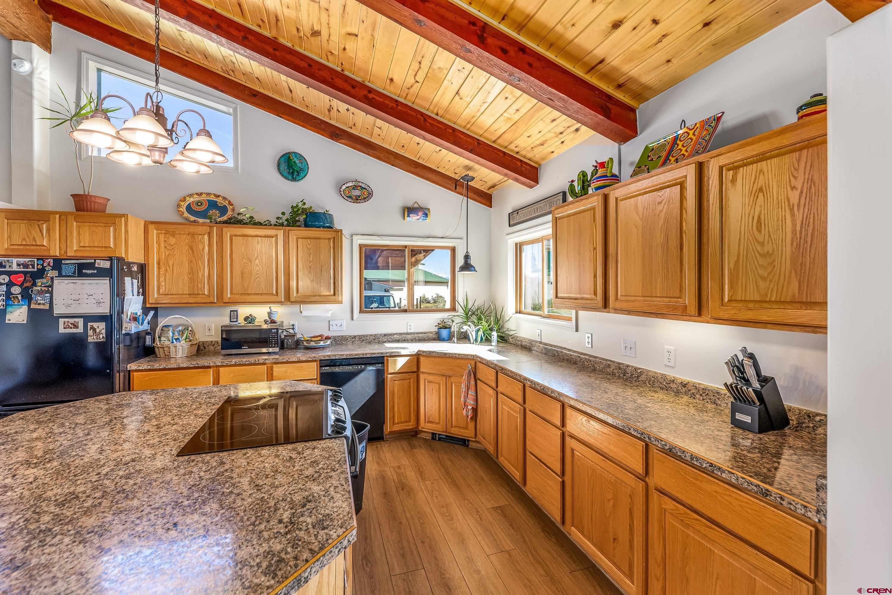 17938 B Road Delta, CO 81416 - Photo 5 of 41 a large kitchen with stainless steel appliances granite countertop a sink and cabinets