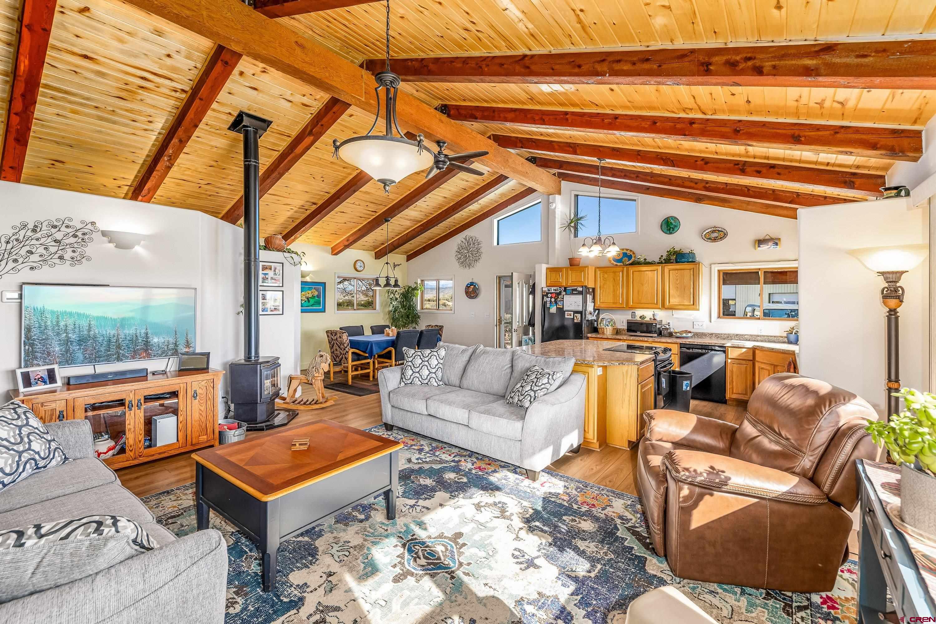 17938 B Road Delta, CO 81416 - Photo 7 of 41 a living room with furniture a rug and a window