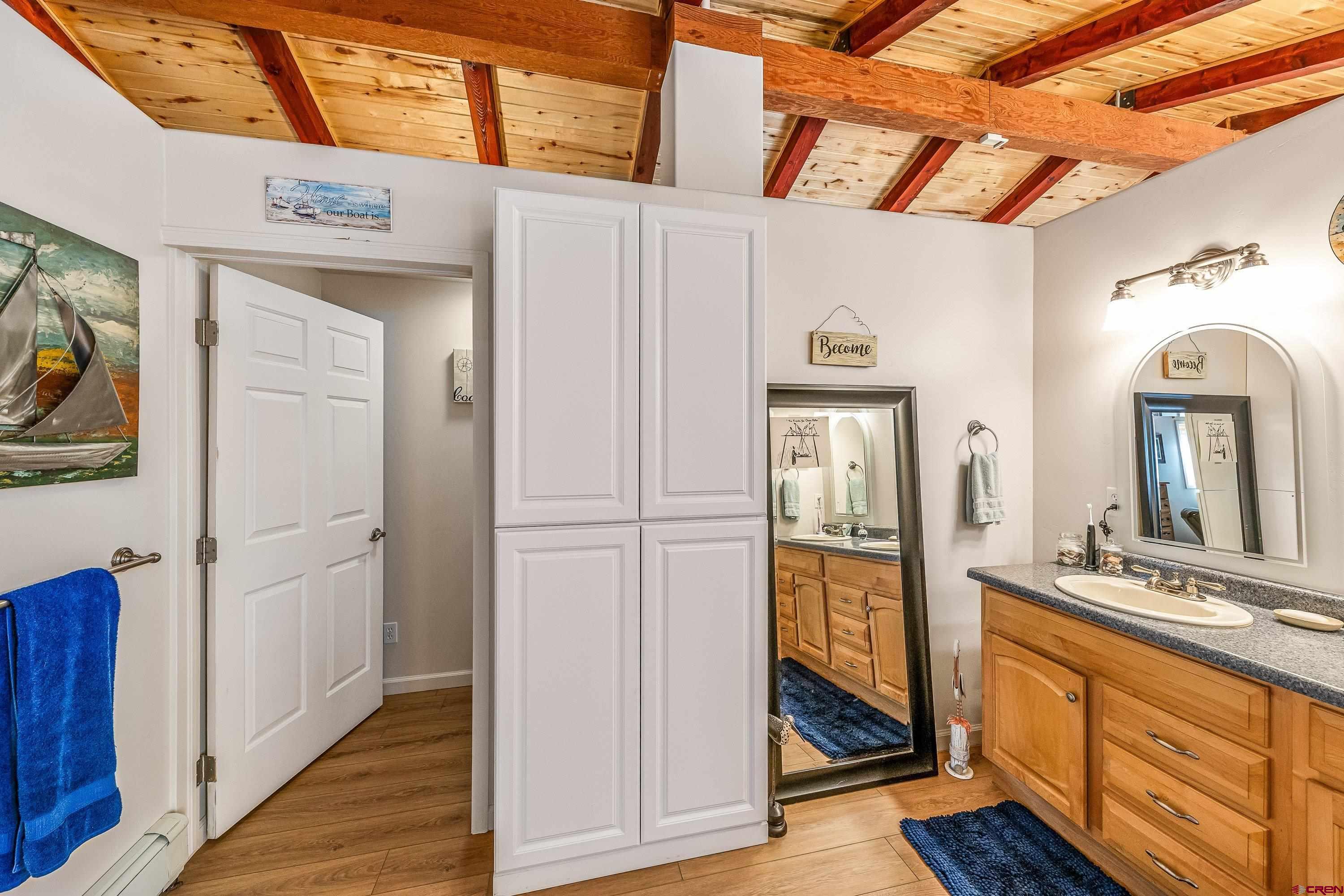 17938 B Road Delta, CO 81416 - Photo 9 of 41 a view of an entryway with wooden floor and mirror