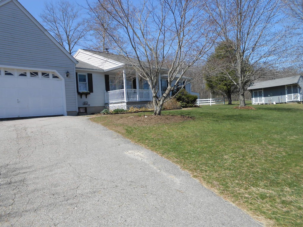 41 Corbin Road Dudley, MA 01571 - Photo 1 of 29 a view of a yard in front of a building