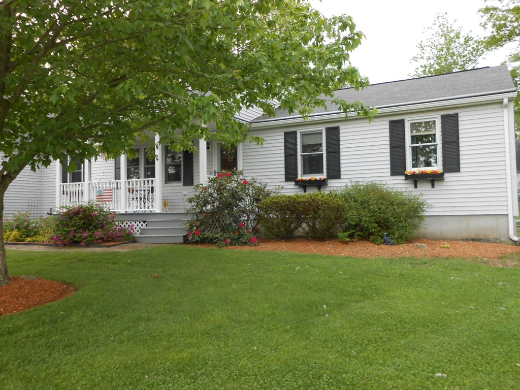 41 Corbin Road Dudley, MA 01571 - Photo 2 of 29 a front view of house with yard and green space