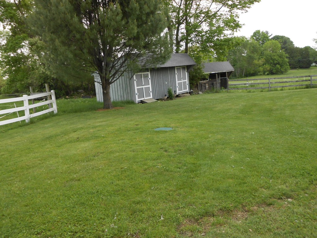 41 Corbin Road Dudley, MA 01571 - Photo 21 of 29 a view of a house with a backyard