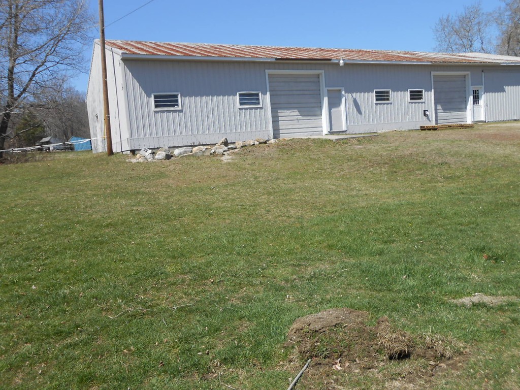 41 Corbin Road Dudley, MA 01571 - Photo 25 of 29 a front view of house with yard and trees